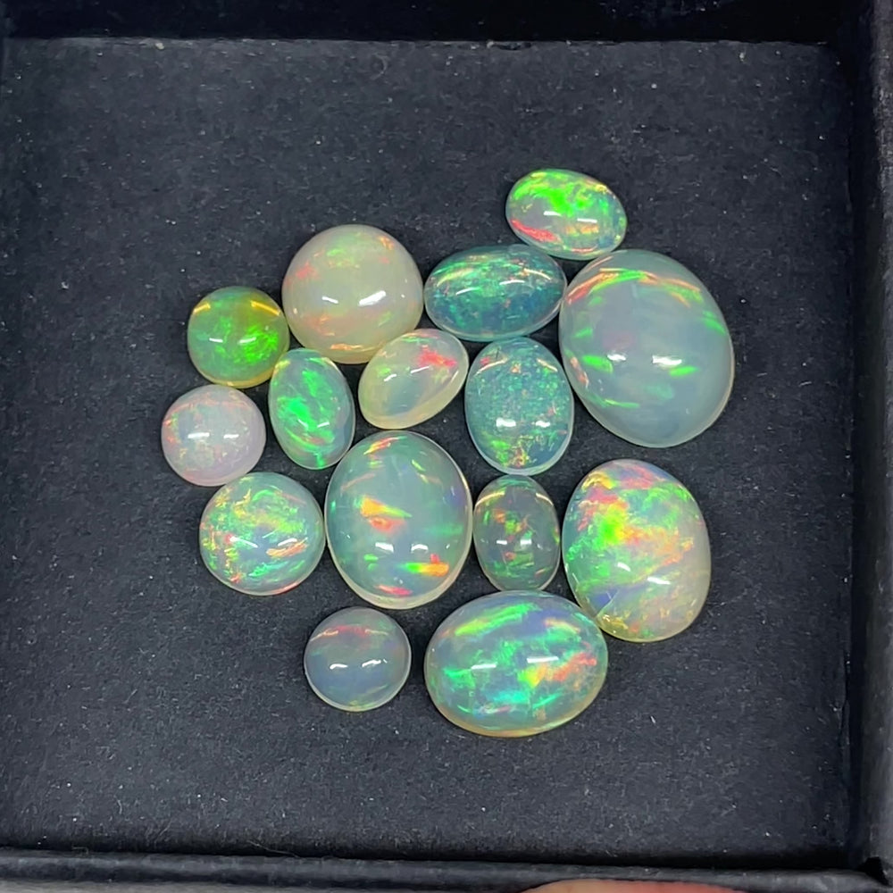 
            
                Load and play video in Gallery viewer, 10cttw AAA Ethiopian Opal gem lot
            
        